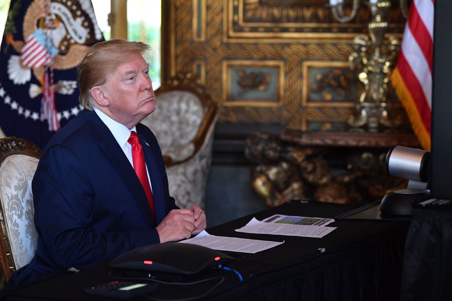 US President Donald Trump makes a video call to the troops stationed worldwide at the Mar-a-Lago estate in Palm Beach Florida, on December 24, 2019. (Photo by Nicholas Kamm / AFP) (Photo by NICHOLAS KAMM/AFP via Getty Images)